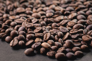 Close up of coffee beans are the background.