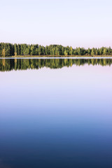 Blue water in forest lake