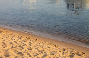brown background sand and blue water