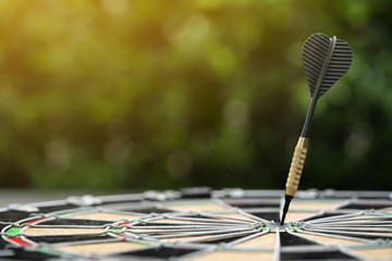 Target dart board on the table, center point, head to target marketing and business success concept