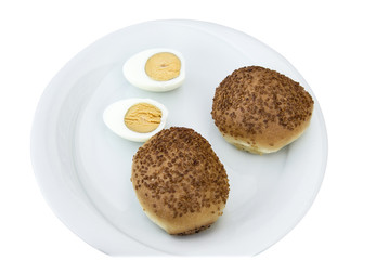Egg half cut with pastry on the plate
