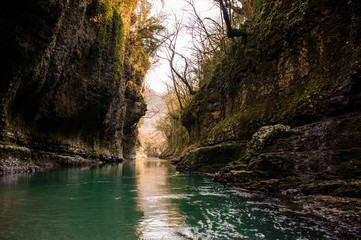 Beautiful landscape of green mountain river flowing among rocks in Martvili canyon