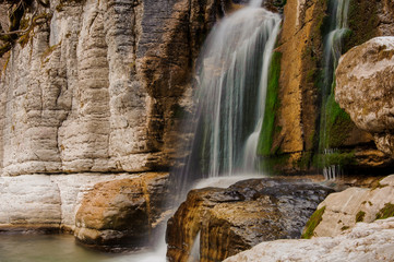 Naklejka premium Beautiful waterfall flowing down the high rock in Martvili canyon