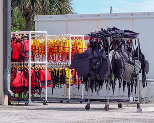 Colorful Life Vests Hanging on Display