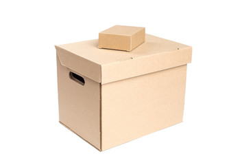 Tiny cardboard box on top of big box.