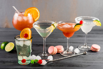 Different kinds of cocktails on the wooden background