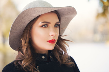 Stylish woman fashion model outdoors, female face closeup