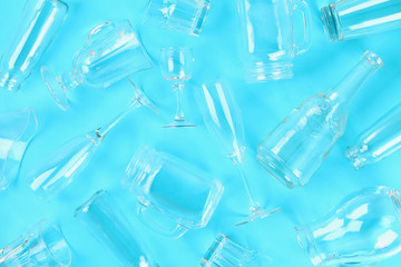 Glassware, glasses, jars on a pastel blue background. Flat lay, top view.