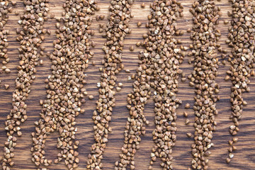 buckwheat groats on an old brown wooden background