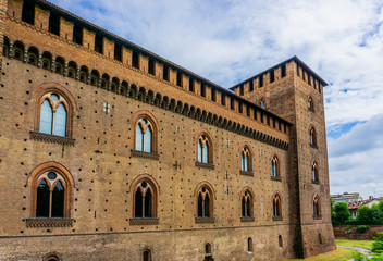 Obraz premium The facade of the Visconti Castle ( castello visconteo ). Medieval building with red brick facades in Pavia, Lombardy, Italy