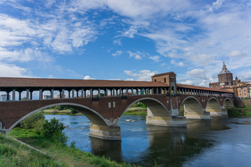 Ponte coperto ( covered bridge ) or Ponte Vecchio over Ticino river in Pavia, Lombardy, Italy