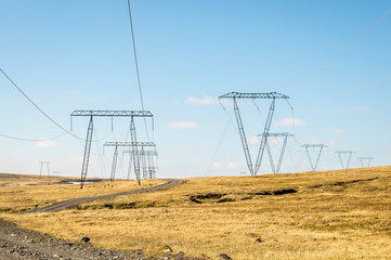 High voltage electric poles located in countryside, Iceland