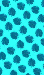 Tropical palm monstera leaves lies on a pastel colored paper. Nature summer concept pattern. Flat...