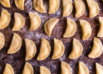 close up of homemade italian pasta ravioli over a wood table
