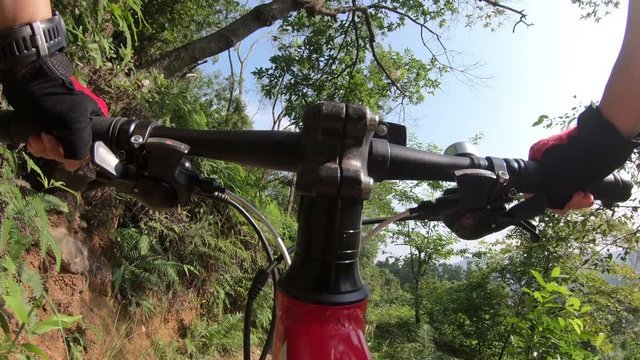 Mountain biking in a forest. POV point of view  4k video with sound
