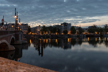 Fototapeta premium The Amstel River in Amsterdam by Night