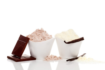 Chocolate and Vanilla protein powder in cups.