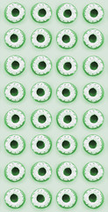 Many small plastic donuts lies on a pastel colorful background. Flat lay minimal pattern. Top view