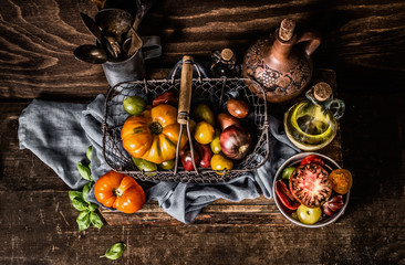 Colorful ,organic ,tomatoes, harvest ,basket , dark, rustic ,kitchen, table , cooking, ingredients,Healthy, food ,concept