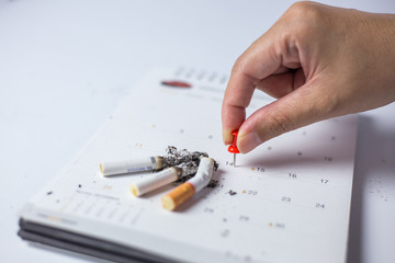 Cigarette on the calendar Concept of quitting smoking