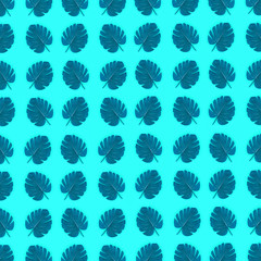 Tropical palm monstera leaves lies on a pastel colored paper. Nature summer concept pattern. Flat...