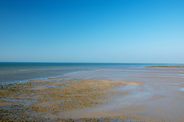 Fototapeta na wymiar English seaside shoreline with the tide out