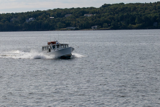 Lobster boat with wake