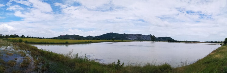 Landscape with sky hill and farmland.