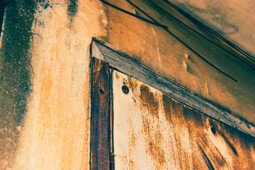 metal door with rust texture and concrete wall