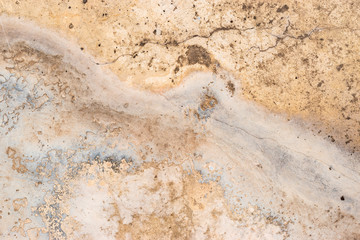 grey concrete floor with crack and water stain
