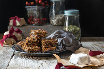 Flapjack of oats, pumpkin seeds, sunflower seeds and dried fruit, in gift packets for Christmas 