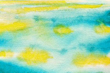 watercolor background with blue and yellow brush strokes