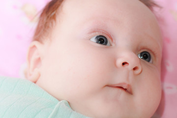 Portrait of the baby of the girl. Cute baby girl.