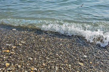 sea surf in the background of rain clouds and sunset