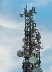 Iron Telecommunication tower with group of parabolic antennas.