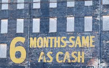 6 months same as cash sign wording on old brick building