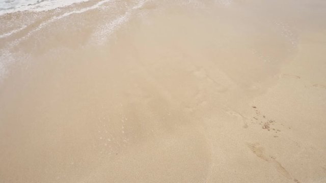 Heart written in the sand disappears