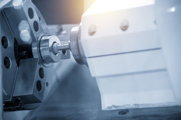 The CNC  grinder machine grinding inside the metal ring.Modern manufacturing process.