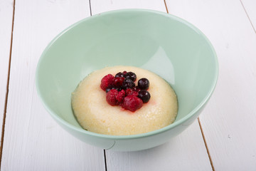 Millet porridge served with berries