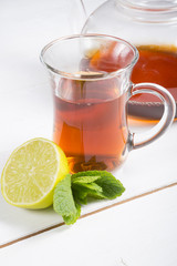 Hot black tea served with lime
