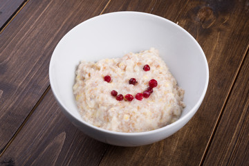 Oatmeal porridge served with cranberries