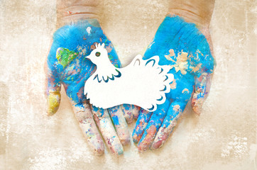 Peace Day .The paper dove on the hands.