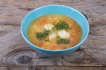 Vegetable soup served with herbs