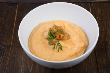 Vegetable cream soup served with croutons