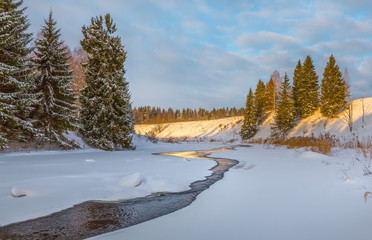 Winter river. Good New Year spirit. Pine and spruce in the snow. Magic clouds. Panoramas.