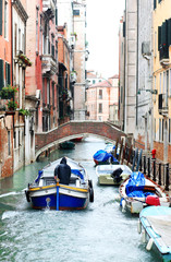 Fototapeta na wymiar motor boat on a canal in Venice, Italy