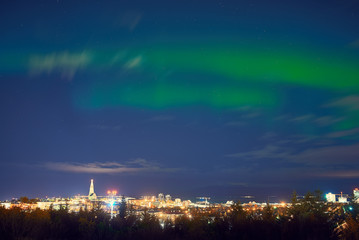 northern lights above Reykjavik in Iceland at night