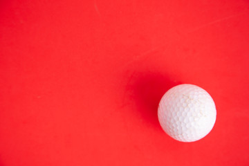 golf ball on red background