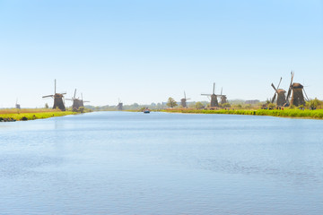 traditional dutch rural scenery with windmills in Kinderdijk at summer day, Netherland