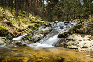 Beautiful waterfall in a forest in Canencia Madrid
